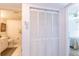 Bright bathroom features a toilet, sink, and closet with plenty of storage space at 5725 Greenwood Ave # 3104, North Port, FL 34287