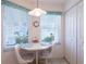Charming breakfast nook with natural light, a table with seating for two, and a view of the exterior at 5725 Greenwood Ave # 3104, North Port, FL 34287