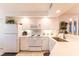 Fully-equipped kitchen with white cabinetry and plenty of counter space for meal prep at 5725 Greenwood Ave # 3104, North Port, FL 34287