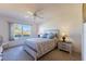 Comfortable bedroom with ceiling fan, large window and closet, providing ample space at 5725 Greenwood Ave # 3104, North Port, FL 34287