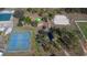 Aerial shot showcasing tennis courts, a volleyball court and a playground within the community at 5725 Greenwood Ave # 3104, North Port, FL 34287