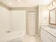 Well-lit bathroom featuring a soaking tub, shower combination, and a granite vanity at 623 Oak Hill Cir # 28, Sarasota, FL 34232
