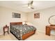 Comfortable bedroom featuring dark wood furniture and neutral colored walls at 623 Oak Hill Cir # 28, Sarasota, FL 34232