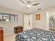 Comfortable bedroom featuring a ceiling fan, a window and a decorative wood chest at 623 Oak Hill Cir # 28, Sarasota, FL 34232