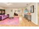 Cozy living room featuring hardwood floors and a unique purple couch at 623 Oak Hill Cir # 28, Sarasota, FL 34232