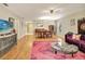 Open-concept living space with dining area, featuring hardwood floors and ample natural light at 623 Oak Hill Cir # 28, Sarasota, FL 34232