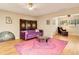 Cozy living room with a comfortable purple sofa, decorative screen, and a modern glass coffee table at 623 Oak Hill Cir # 28, Sarasota, FL 34232