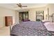 Serene main bedroom with a wrought iron bed frame and sliding glass doors to the outdoor patio at 623 Oak Hill Cir # 28, Sarasota, FL 34232