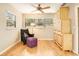 Bright office space with natural light, a cozy chair and a unique storage cabinet at 623 Oak Hill Cir # 28, Sarasota, FL 34232