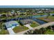 Aerial view of the beautiful waterfront homes with brick driveways at 855 Rotonda Cir, Rotonda West, FL 33947