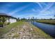 Waterfront backyard with direct access to the canal for boating and beautiful views at 855 Rotonda Cir, Rotonda West, FL 33947