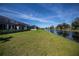 Spacious green backyard with canal view at 855 Rotonda Cir, Rotonda West, FL 33947