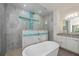 Modern bathroom featuring a soaking tub and a glass-enclosed shower with stylish tiling at 855 Rotonda Cir, Rotonda West, FL 33947