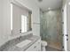 Bathroom featuring a granite countertop vanity, shower with stone floor, and white fixtures at 855 Rotonda Cir, Rotonda West, FL 33947