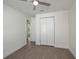 Bedroom featuring a ceiling fan, light gray floors, neutral paint, and bi-fold closet doors at 855 Rotonda Cir, Rotonda West, FL 33947