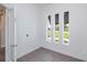 Bright bedroom with three vertical windows providing lots of natural light at 855 Rotonda Cir, Rotonda West, FL 33947