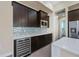 Bright kitchen with stainless steel appliances and wine cooler at 855 Rotonda Cir, Rotonda West, FL 33947