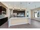 Island kitchen with stainless steel appliances and white countertops at 855 Rotonda Cir, Rotonda West, FL 33947