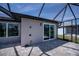 Comfortable patio area with outdoor shower and sliding door access at 855 Rotonda Cir, Rotonda West, FL 33947