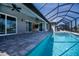 Outdoor living at its finest with a beautiful pool and lanai area at 855 Rotonda Cir, Rotonda West, FL 33947