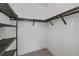 Spacious walk-in closet with custom metal shelving and ample storage at 855 Rotonda Cir, Rotonda West, FL 33947