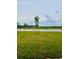 Expansive backyard featuring serene water views and lush green space at 9516 Turtle Grass Cir, Punta Gorda, FL 33950