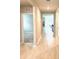 Well-lit hallway features neutral paint, access to multiple rooms, and attractive tiled flooring at 9516 Turtle Grass Cir, Punta Gorda, FL 33950