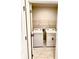 Convenient laundry area with a full-size washer and dryer and wire shelving for ample storage space at 9516 Turtle Grass Cir, Punta Gorda, FL 33950