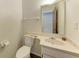 Powder room features a pedestal sink, toilet, and custom counter at 1052 Hinton St, Port Charlotte, FL 33952
