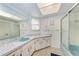 Bathroom featuring a sleek vanity with a blue sink and plenty of storage at 1052 Hinton St, Port Charlotte, FL 33952