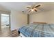 Spacious bedroom featuring wood-look flooring and doorway to an en-suite bathroom at 1052 Hinton St, Port Charlotte, FL 33952