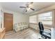 Bedroom with a workstation, love seat and large window at 1052 Hinton St, Port Charlotte, FL 33952