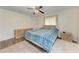 Cozy bedroom features a ceiling fan, natural light, and a soft rug at 1052 Hinton St, Port Charlotte, FL 33952