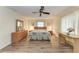 Primary bedroom with ceiling fan, a window and matching furniture at 1052 Hinton St, Port Charlotte, FL 33952