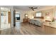Bright bedroom featuring wood-look flooring, ceiling fan, and a connected bathroom at 1052 Hinton St, Port Charlotte, FL 33952