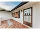 The front entry to this single story home has a brick paver landing at 1052 Hinton St, Port Charlotte, FL 33952