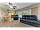 Open living area showcasing dining space, ceiling fan, and access to the lanai at 1052 Hinton St, Port Charlotte, FL 33952