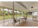 Screened patio with neutral colored furniture and a view of the backyard at 1052 Hinton St, Port Charlotte, FL 33952