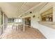 Relaxing screened patio with tiled floors and direct access to the backyard at 1052 Hinton St, Port Charlotte, FL 33952