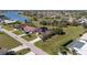 Expansive aerial view of a residential neighborhood featuring lake views and well-maintained lawns at 1225 Neapolitan Rd, Punta Gorda, FL 33983