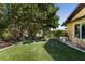 Lush backyard featuring artificial turf and a landscaped border at 1225 Neapolitan Rd, Punta Gorda, FL 33983