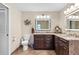 Stylish bathroom boasting double sinks with granite countertops, elegant fixtures, and decorative accents at 1225 Neapolitan Rd, Punta Gorda, FL 33983