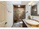 Modern bathroom featuring a glass-enclosed shower, granite vanity, and stylish fixtures at 1225 Neapolitan Rd, Punta Gorda, FL 33983