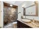 Bathroom featuring granite countertops, a vessel sink, and a modern glass-enclosed shower with beautiful tiling at 1225 Neapolitan Rd, Punta Gorda, FL 33983