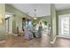 Elegant dining room with a glass-top table, upholstered chairs, and abundant natural light at 1225 Neapolitan Rd, Punta Gorda, FL 33983