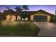 Charming, one-story home featuring a 2-car garage, solar panels, and well-maintained landscaping with lush green lawn at 1225 Neapolitan Rd, Punta Gorda, FL 33983