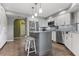 Spacious kitchen featuring a large island, stainless steel appliances, and gray cabinets at 1225 Neapolitan Rd, Punta Gorda, FL 33983