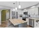 Bright kitchen featuring an island with granite countertops, stainless appliances, and recessed lighting at 1225 Neapolitan Rd, Punta Gorda, FL 33983