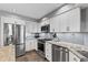 Kitchen boasting stainless steel appliances, granite countertops, and ample cabinet space at 1225 Neapolitan Rd, Punta Gorda, FL 33983