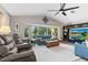 Living room showcasing a large window, vaulted ceilings, and comfortable seating at 1225 Neapolitan Rd, Punta Gorda, FL 33983